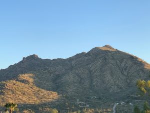 Black Mountain in Cave Creek, Arizona, with desert landscape and homes at the foothills.